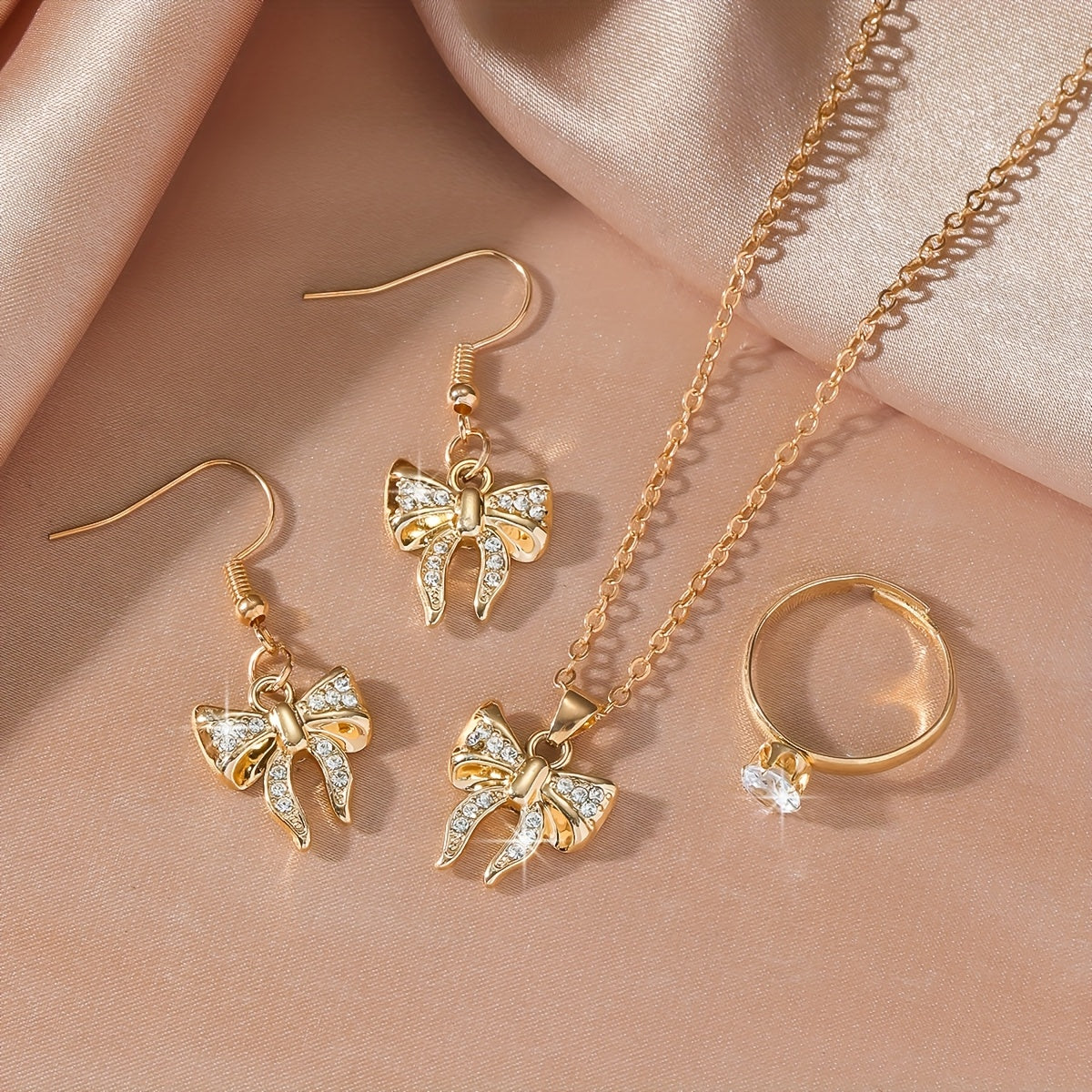 Noéline Strass – collier et boucles d’oreilles à nœud papillon