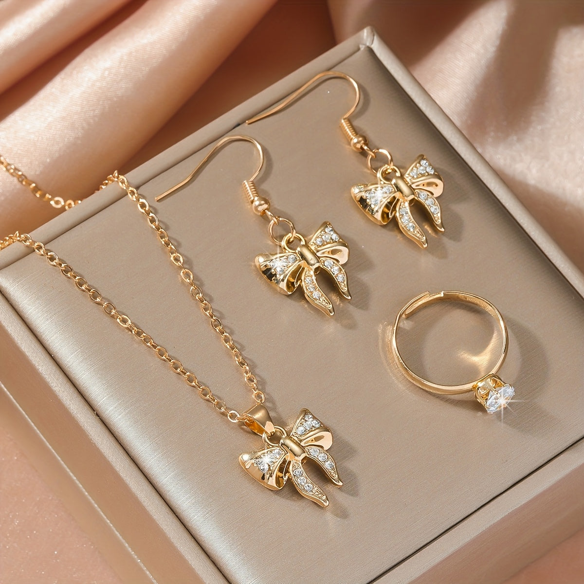 Noéline Strass – collier et boucles d’oreilles à nœud papillon