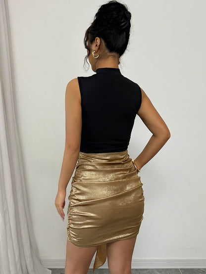 ORÉLIA – Mini robe dorée à volants